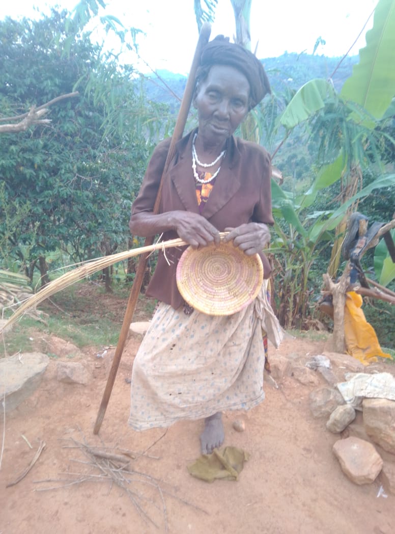 Person with a disability learning basketry skills — MOFA vocational training, Kasese Uganda