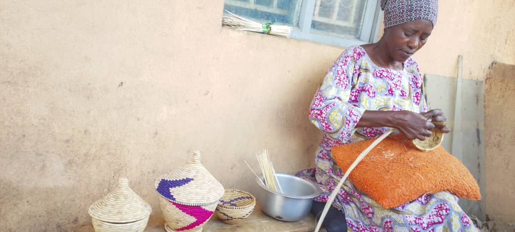 MOFA woman weaving baskets — handcraft program, Kasese Uganda